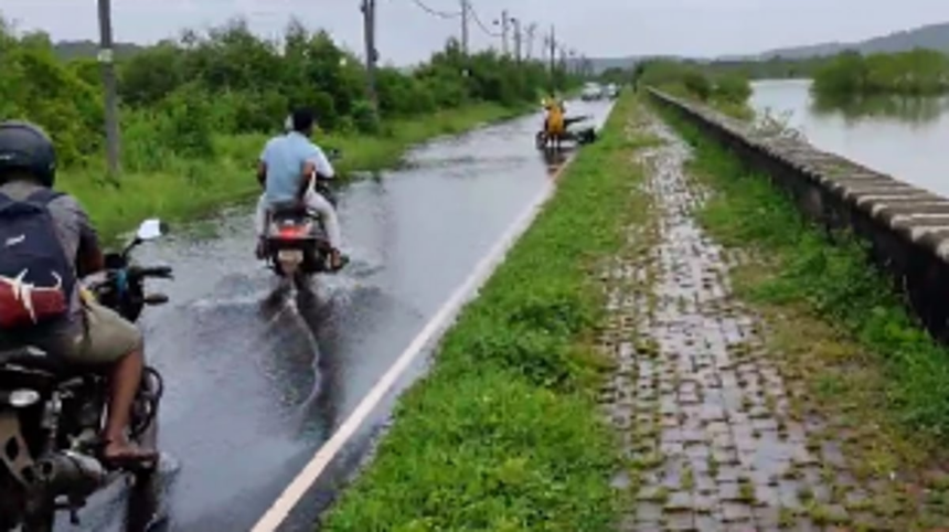 Hazardous road conditions lead to a bike accident as woman falls into submerged pothole in Britona