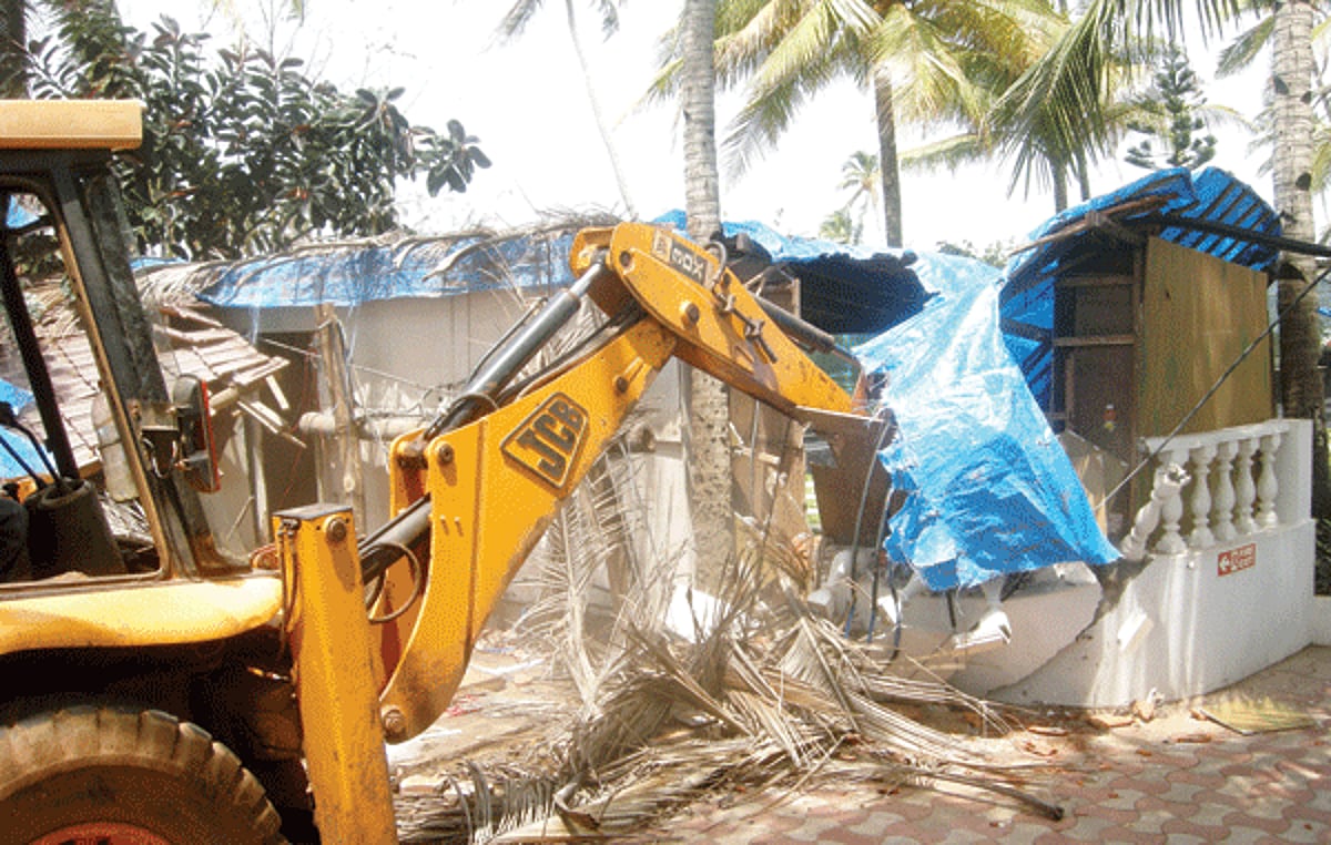 Heavy earth moving machinery engaged to raze down the encroachments on Tourism department's property at Colva