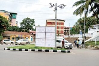 Hoarding erected on traffic island causing hindrance to motorists