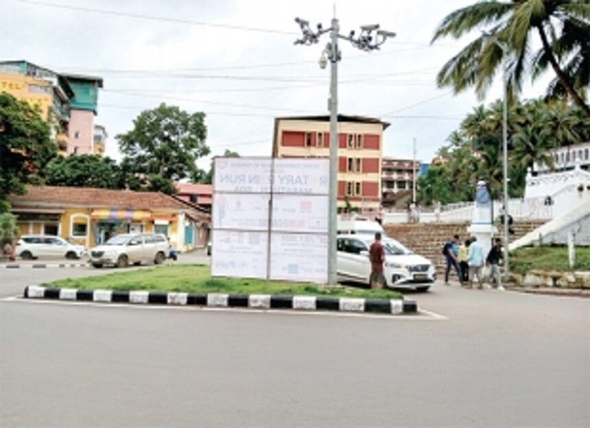 Hoarding erected on traffic island causing hindrance to motorists