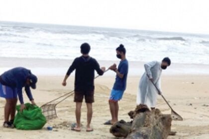 Holy Trinity Church parishioners clean garbage littered on beach