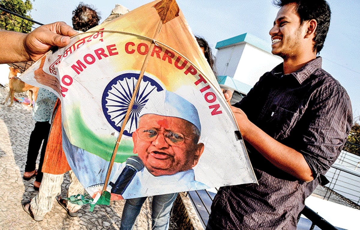Kite flying enthusiasts prepares a kite showcasing Anna Hazare at a kite flying event held on the occasion of Makar Sankranti at Porvorim on Tuesday.
