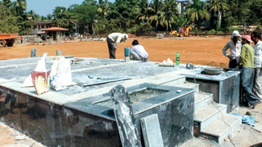 Labourers giving final touches to the stage, which is built outside the new Collectorate building 1 Labourers giving final touches to the stage, which is built outside the new Collectorate building