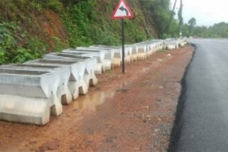 Large concrete dividers removed to reduce accident risk, but furrows left behind