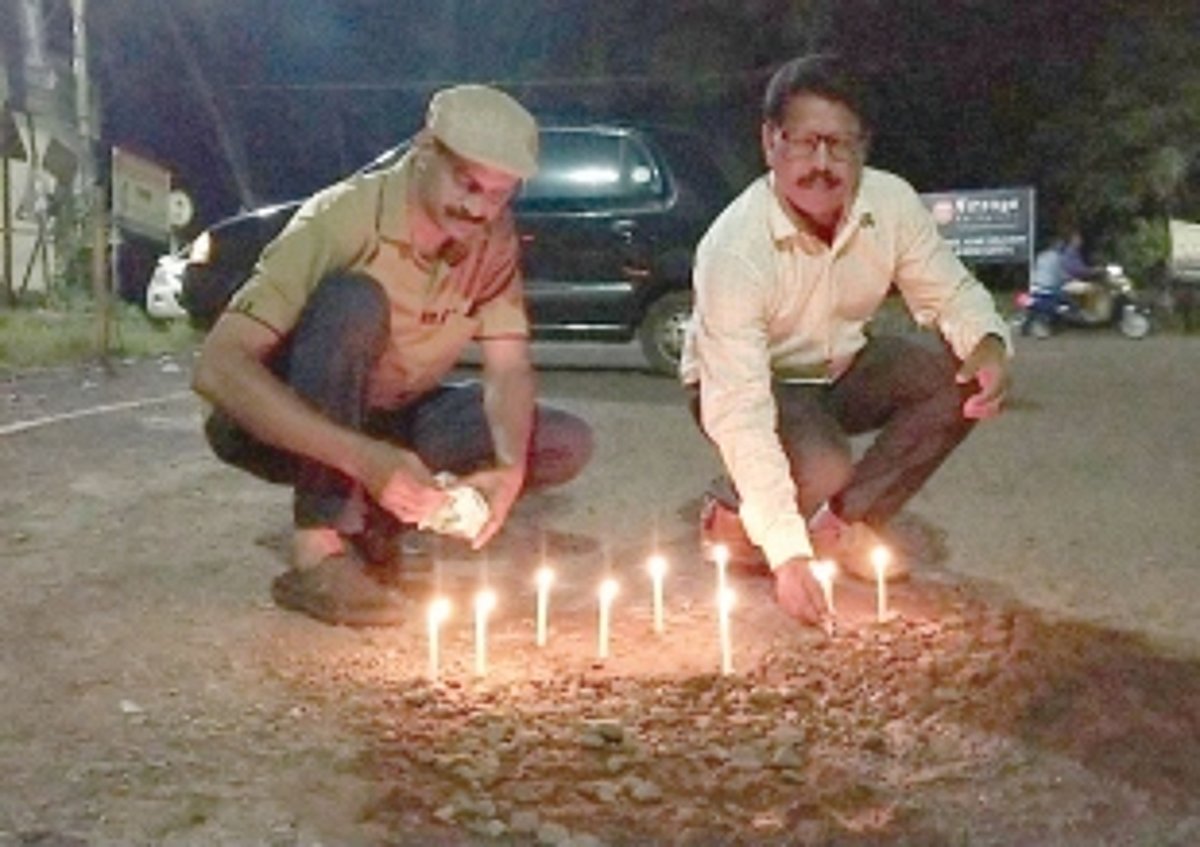 Locals light candles in potholes at Pernem