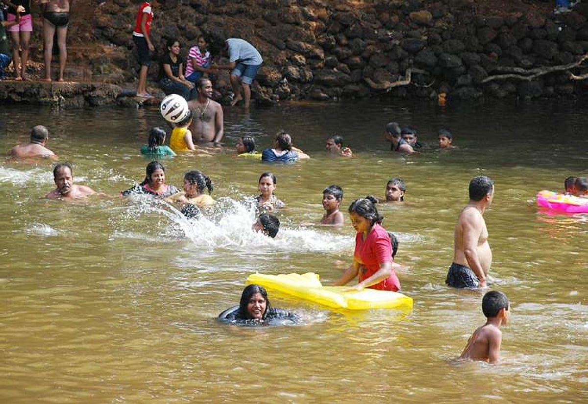 Locals on a picnic at Collem take time to cool off as temprature in the State has been witnessing a sharp rise in recent times..