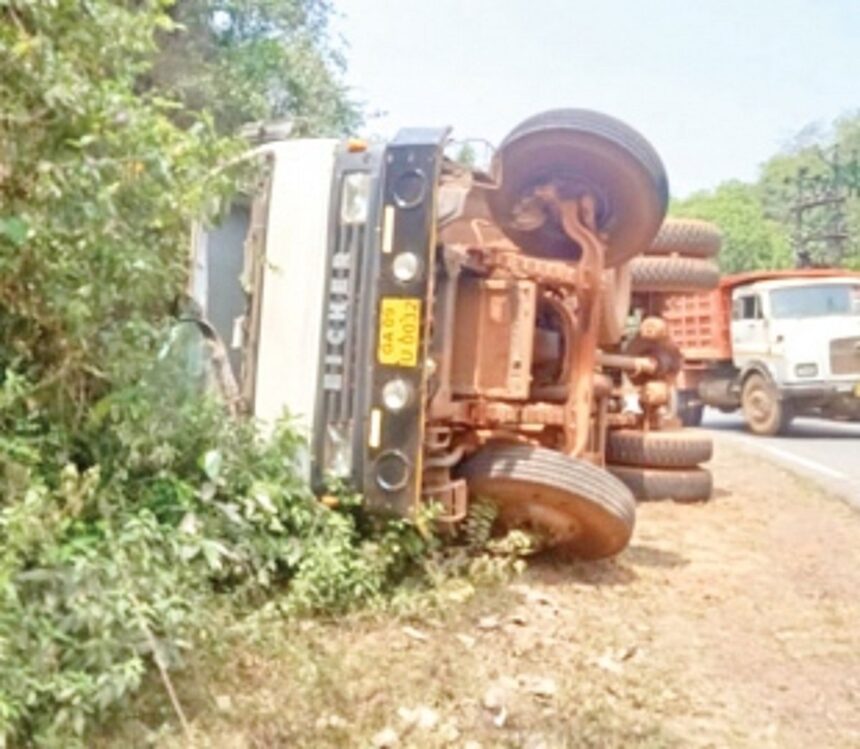 Lucky escape for driver as  truck falls on its side