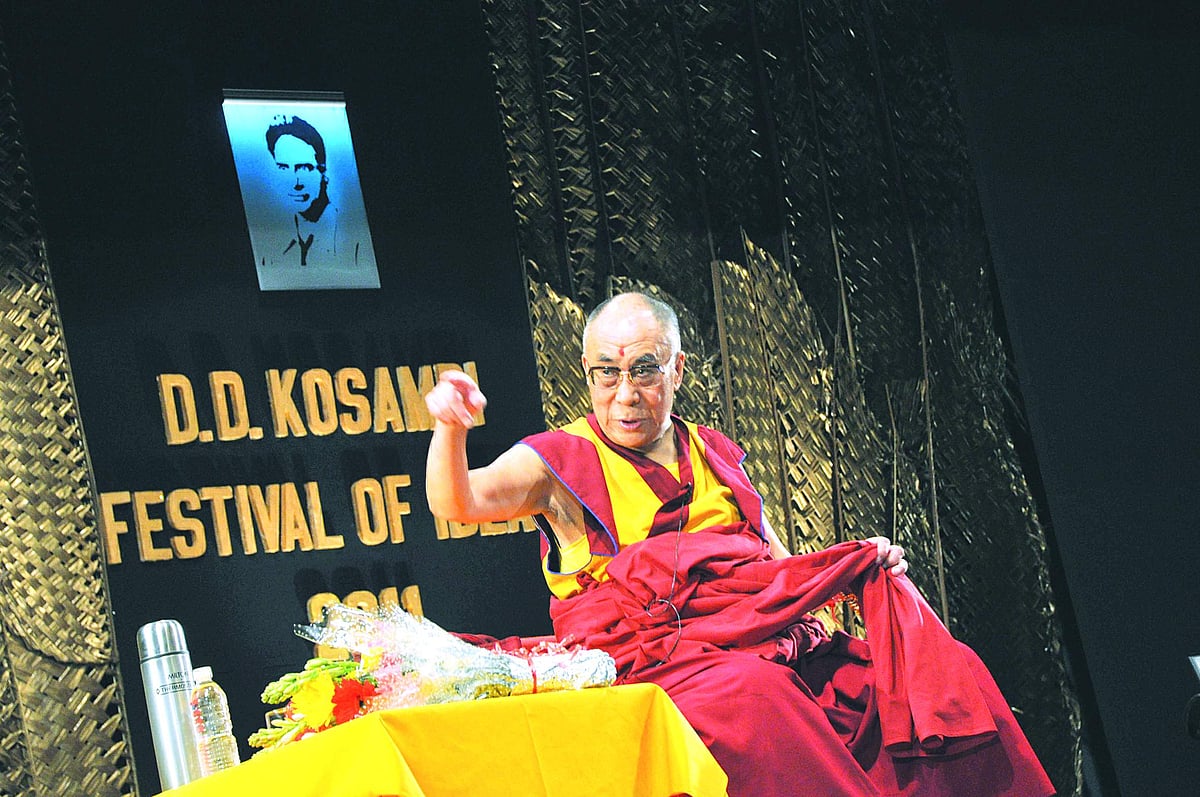 MAKING A POINT:  The Dalai Lama addressing a gathering during D D Kosambi Festival of Ideas at Kala Academy in the city on Monday.