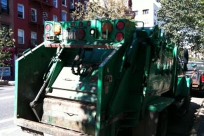 MMC commissions  2 compactor trucks
