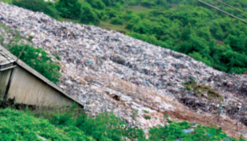 MMC uses machinery to make way for  waste-laden trucks at Sonsoddo