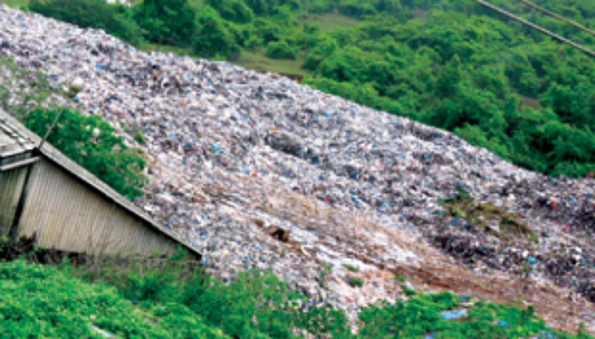 MMC uses machinery to make way for  waste-laden trucks at Sonsoddo