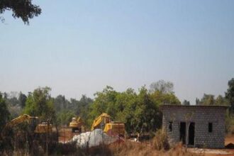 Machinery and construction activity at the proposed mining site at Vathadev-Bicholim.
