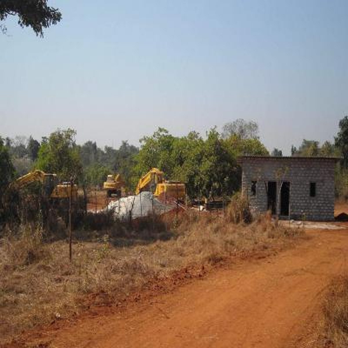 Machinery and construction activity at the proposed mining site at Vathadev-Bicholim.