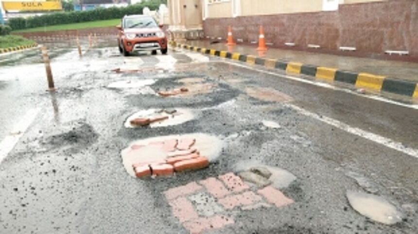 Main entrance road leading to Mopa Airport full of potholes 1 Main entrance road leading to Mopa Airport full of potholes