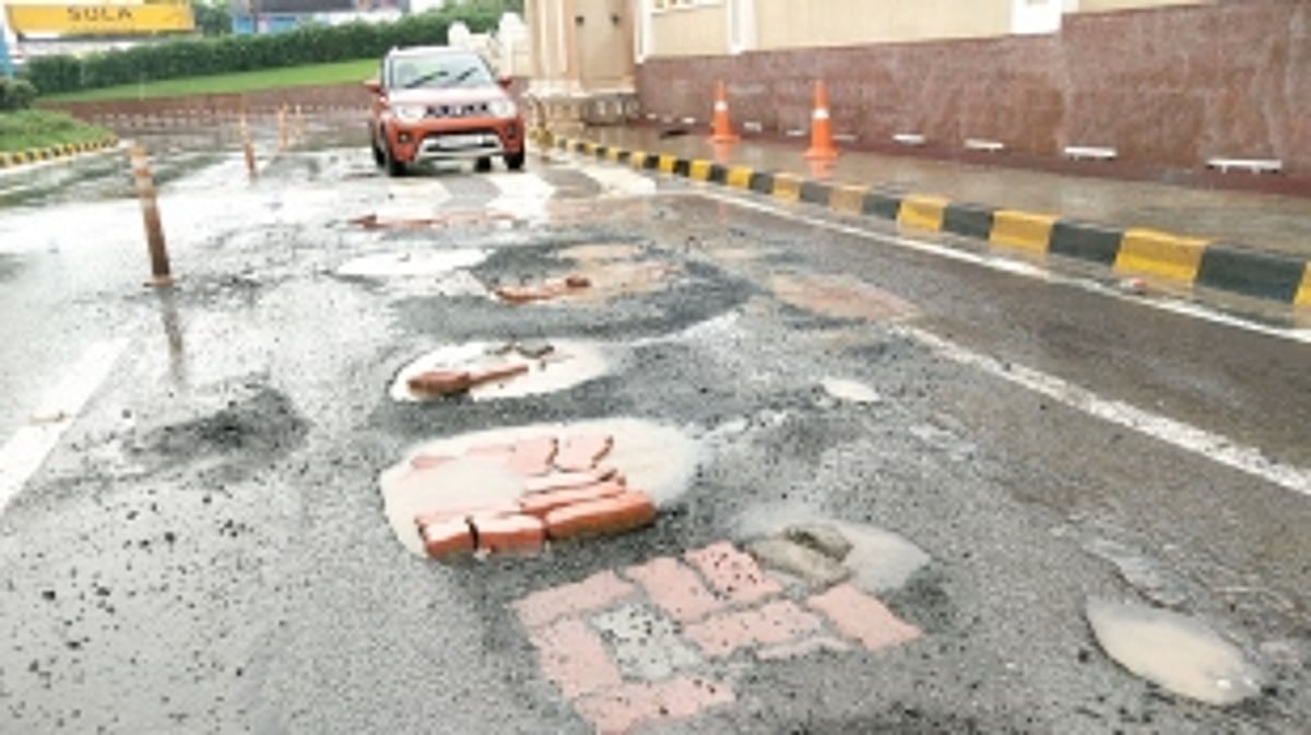 Main entrance road leading to Mopa Airport full of potholes