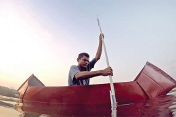 Making his boats, rowing them too