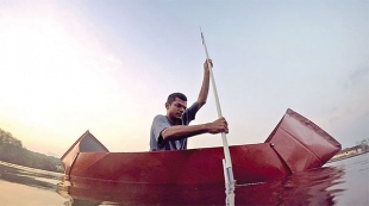 Making his boats, rowing them too