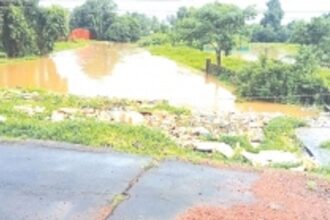Mandopa rivulet choked with massive quantities of plastic, styrofoam