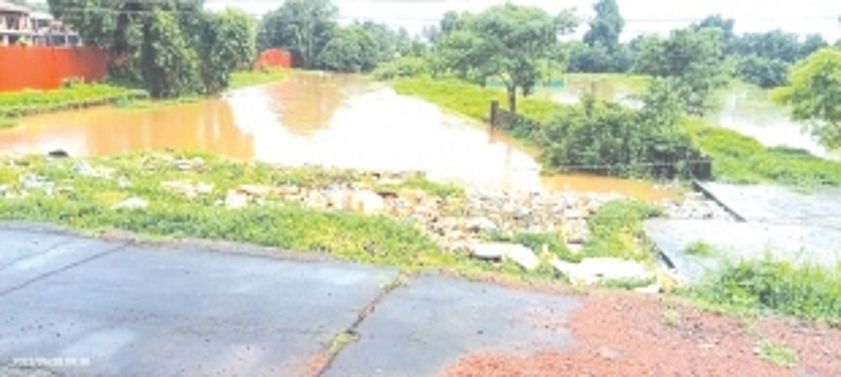 Mandopa rivulet choked with massive quantities of plastic, styrofoam