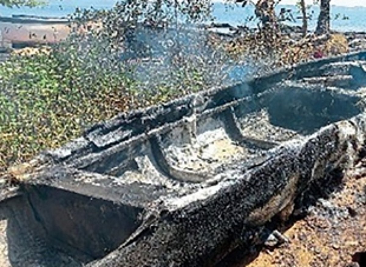 Miscreants set fire to canoes,  fishing nets at Cacra