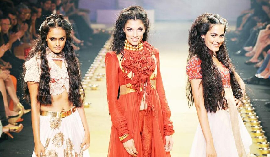 Models walk the ramp to display the creations of designer Anamika Khanna on the final day of The Lakme Fashion Week in Mumbai.