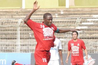 Musli Power Churchill Brothers Odafa Okolie takes a leap to avoid a clash with Shillong Lajong Football Club goalkeeper R Lalthuammawia, as the latter makes a brilliant save.