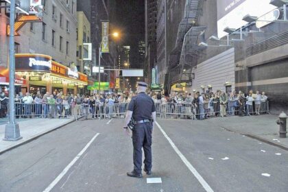 New York City Police direct pedestrians behind barricades in Times