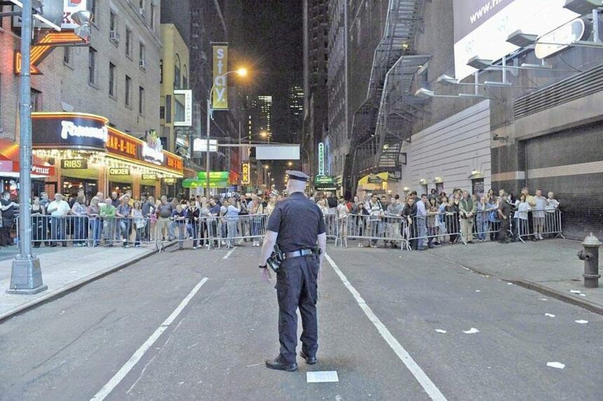 New York City Police direct pedestrians behind barricades in Times
