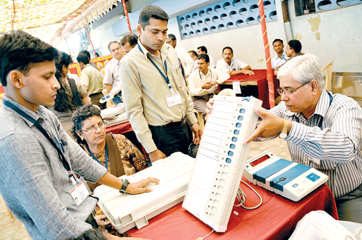 Officials conduct last minute checks on voting machines in Panjim.