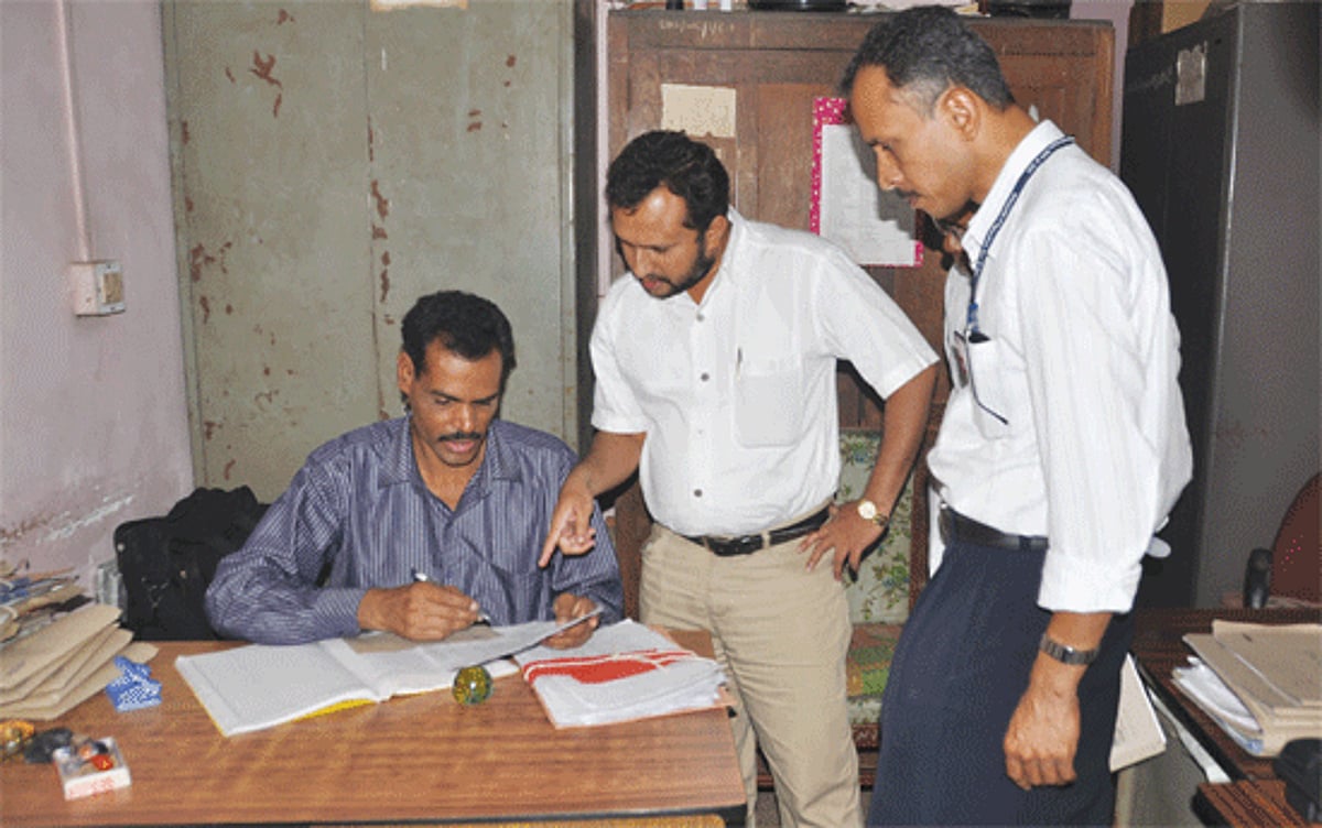 Officials of the Election Commission inspecting the recruitment-related files during the raid at the Health Department premises, Campal-Panjim on Thursday.