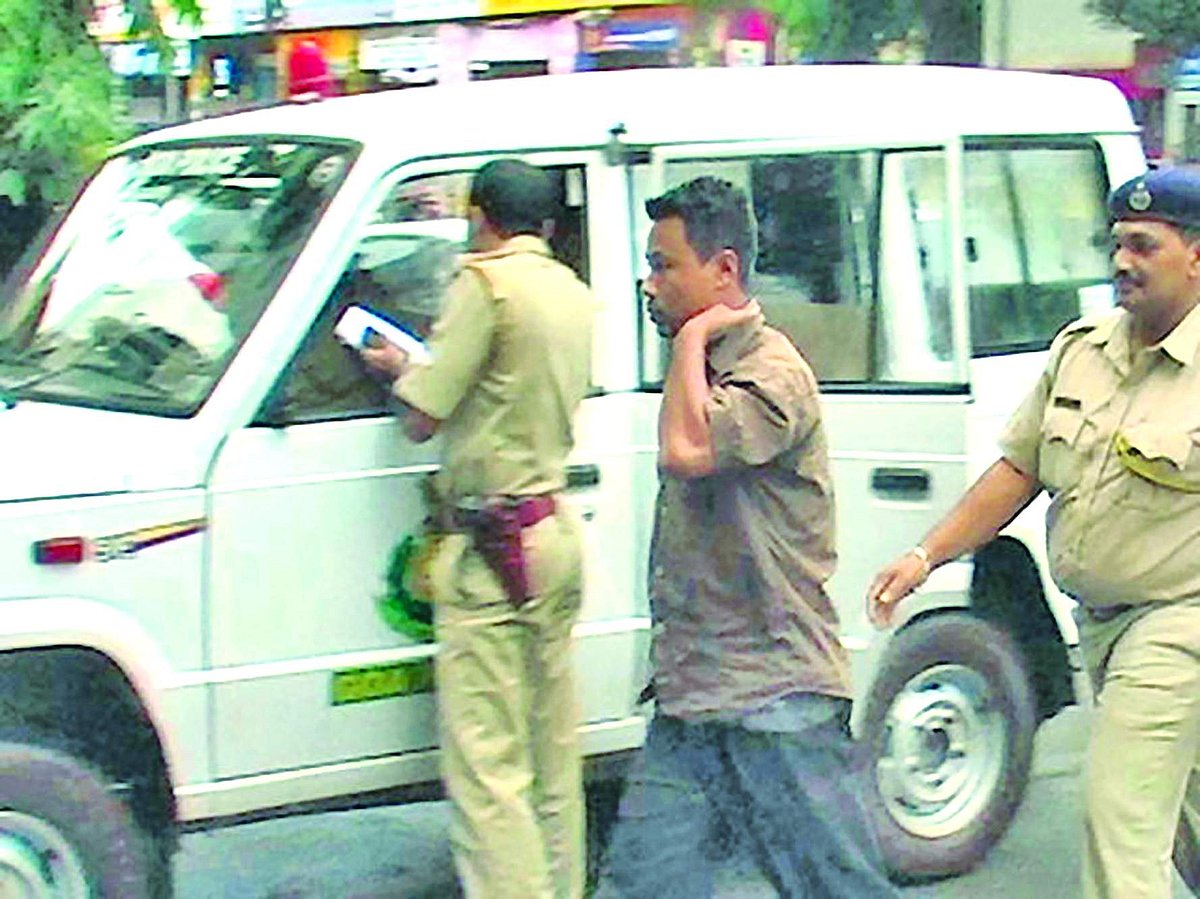 One of the members of a banned outfit from Manipur being taken to Ponda police station.