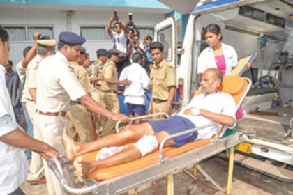 One of the prisoners being taken out of the ambulance