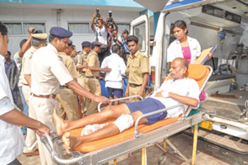 One of the prisoners being taken out of the ambulance