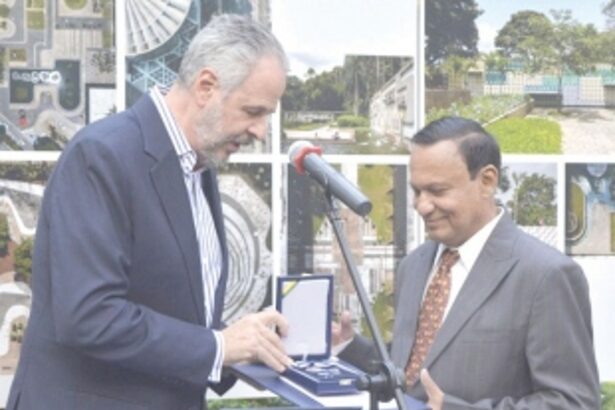 Orlando Costa   bestowed with   a medal by Brazil   Ambassador
