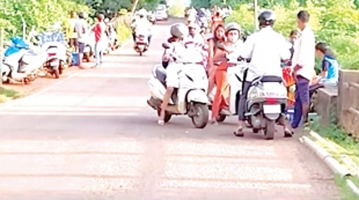 PUTTING LIFE AT RISK: Fish vendors do  business by the roadside at Saleri, Khola