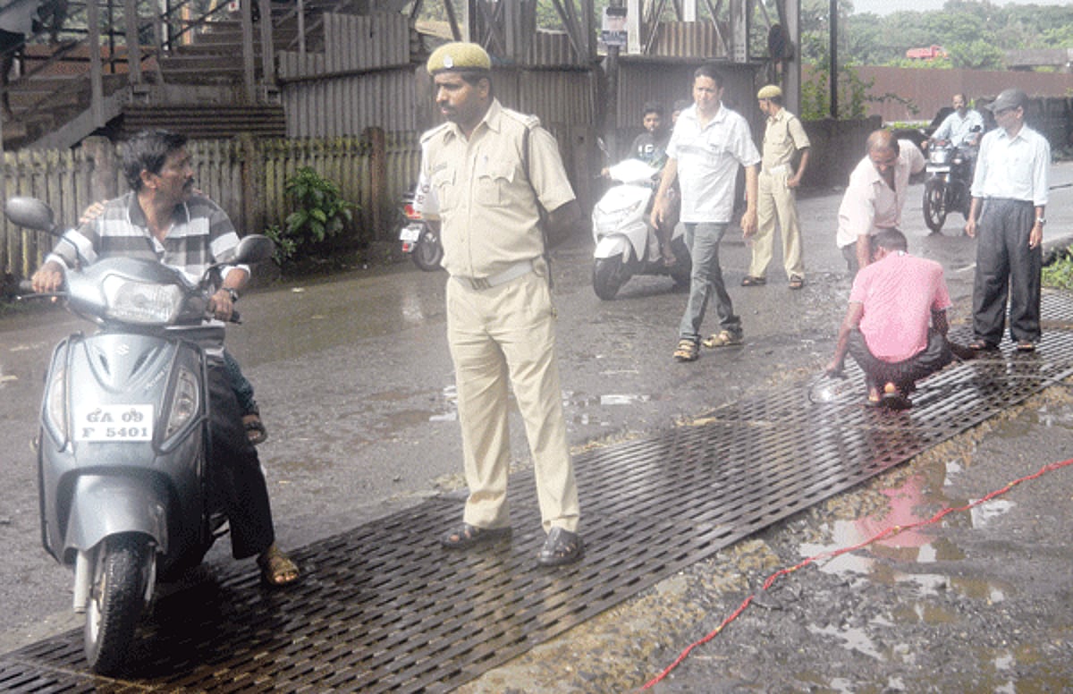 PWD junior engineer Swapnil Dessai supervises a fabricator as he welds iron tags on the slippery railing at Curchorem to make it rough. Herald had highlighted the danger while crossing over this railing as it was slippery and risky.