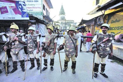 Paramilitary troops stand guard on a street in Ayodhya on Wednesday.
