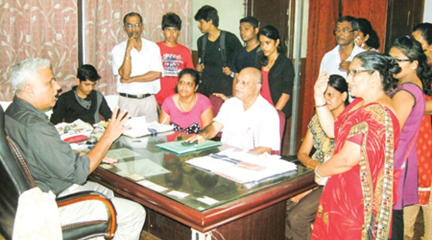 Parents and students confronting Deputy Director of  Education, Ramkrishna Samant.