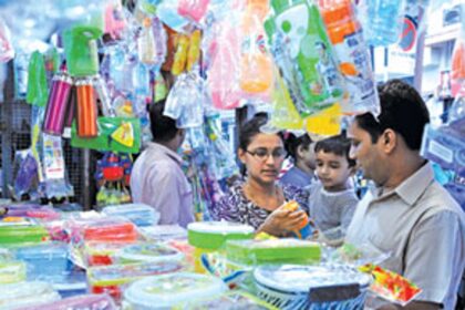 Parents shop for water bottles, raincoats and other items for their children