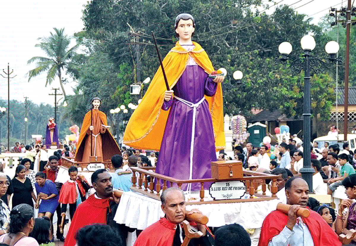 Parishioners of St Andrew's Church take part in the annual Penitential Procession of the Saints (Santanchem Pursanv) at Goa Velha on Monday. Life size statues of 31 saints belonging to the Franciscan Order are taken around the village annually on the fif