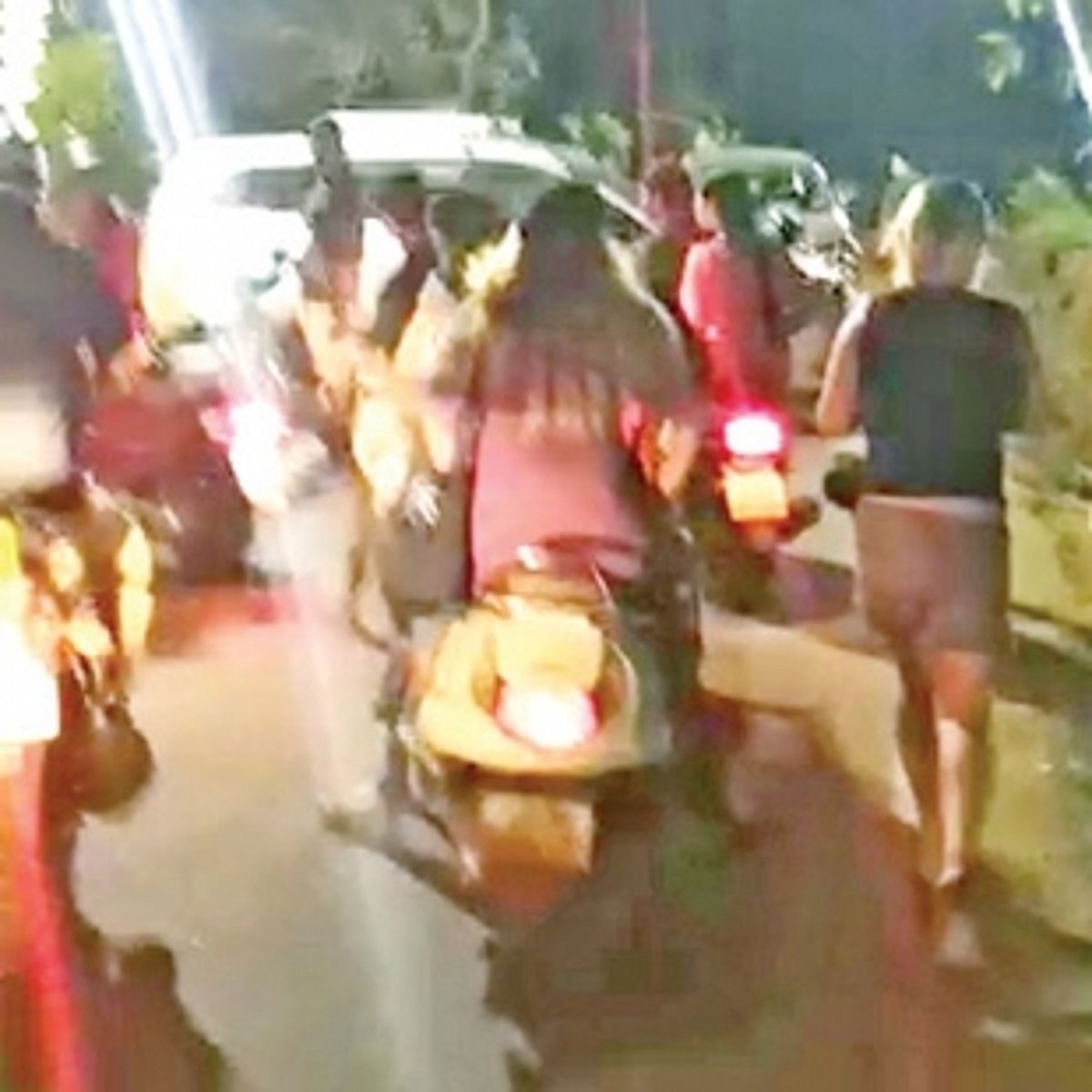 Parked tourist taxi rolls  down from ramp at Palolem