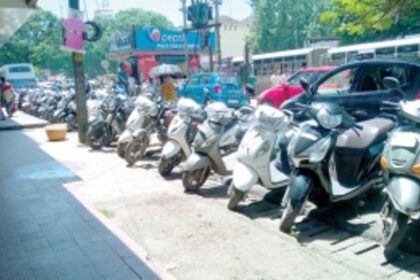 Parked two-wheelers leave little space for pedestrians