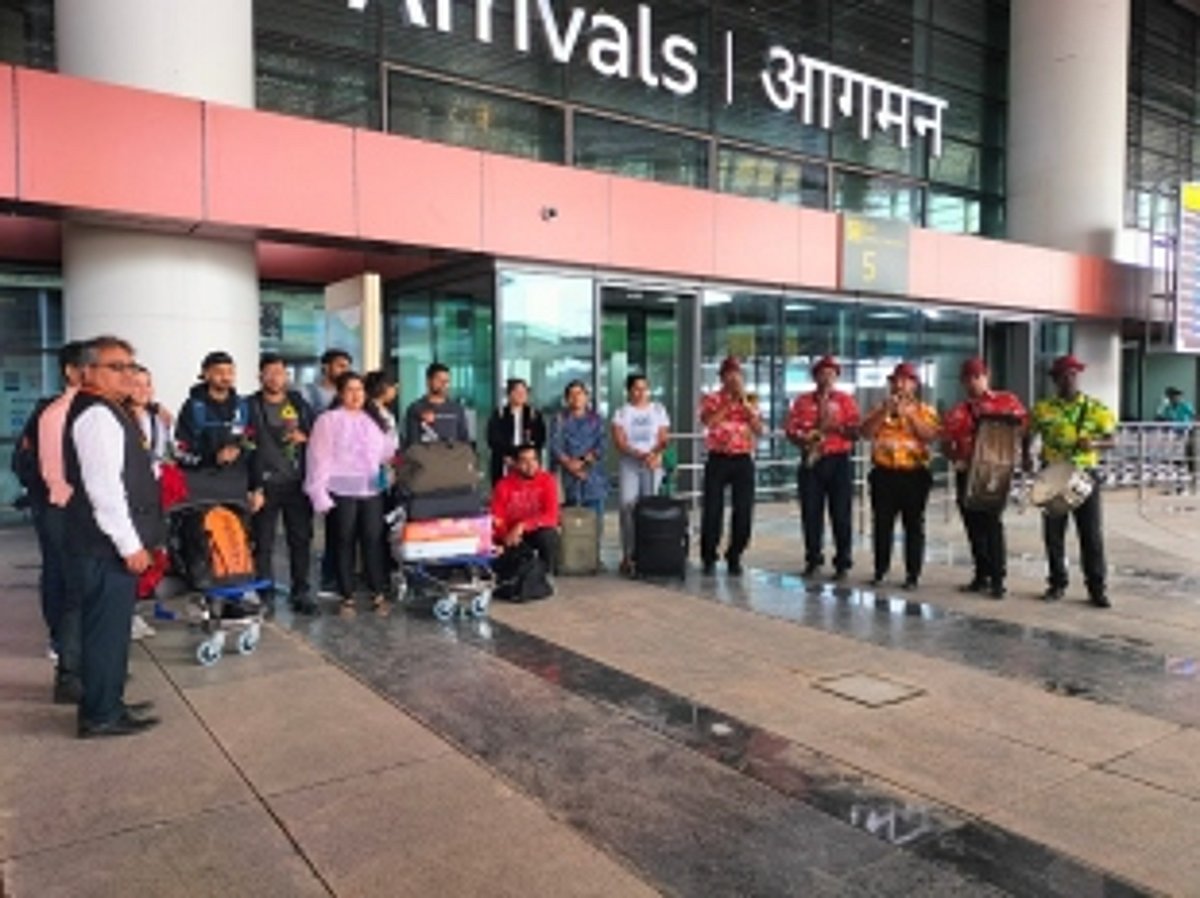 Passengers on first flight that lands at Mopa airport break into a jig on arrival