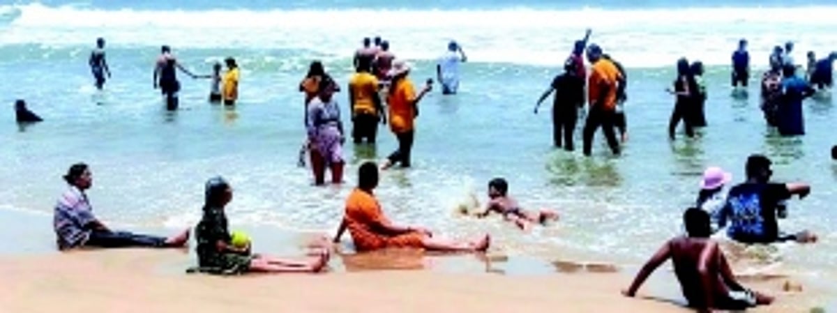 People throng Baga Beach for ‘health boosting’ summertime dip