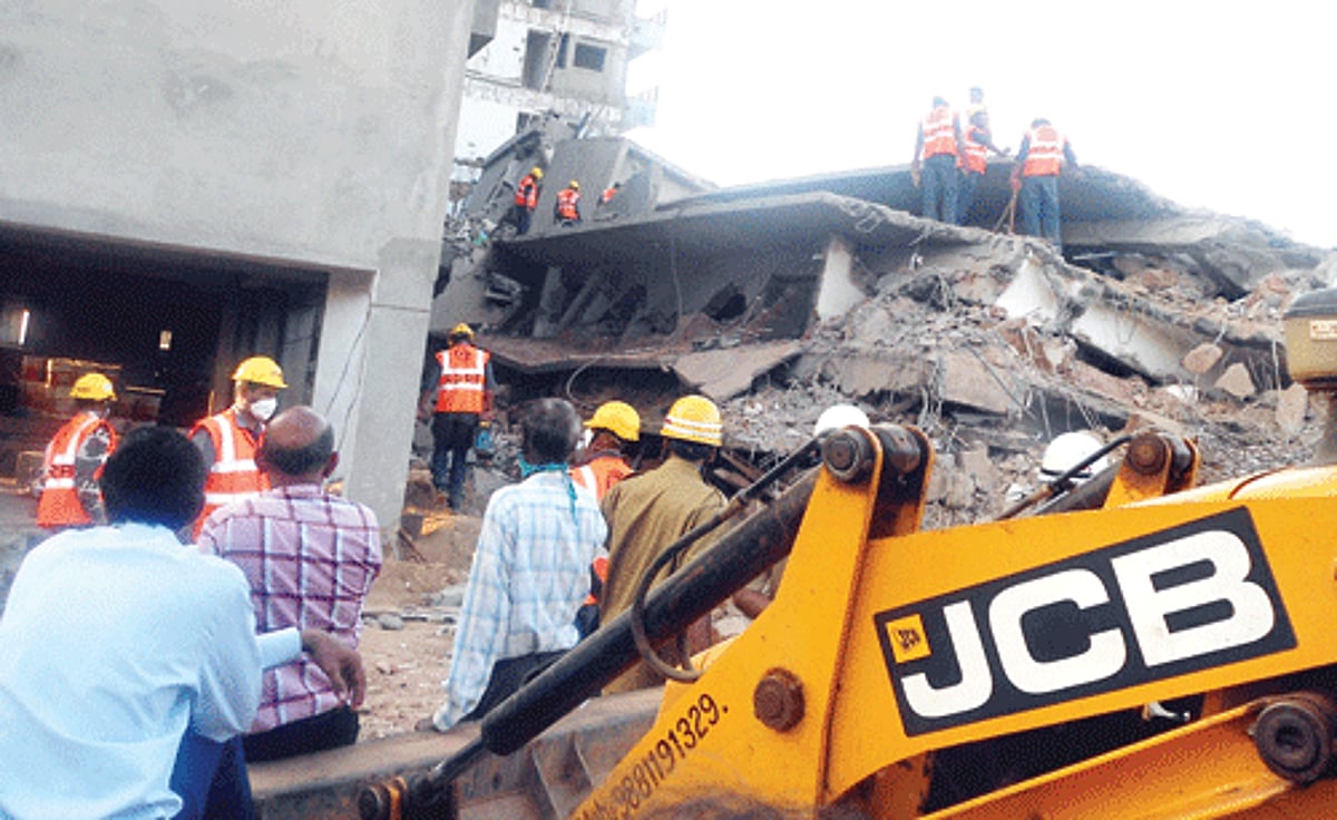 Personnel from the NDRF, fire services and PWD conduct manual operations to locate bodies from debris of the collapsed building on Tuesday evening.