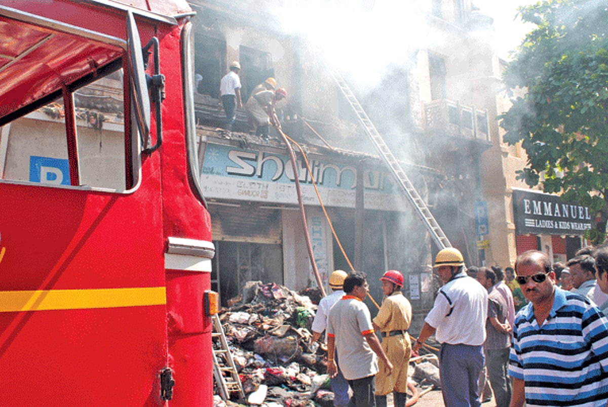 Personnel of the Fire and Emergency Services involved in fire fighting operations at the Mormugao Municipal market.