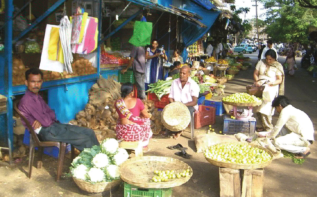 Policemen push a police jeep of the Ponda Traffic Cell.