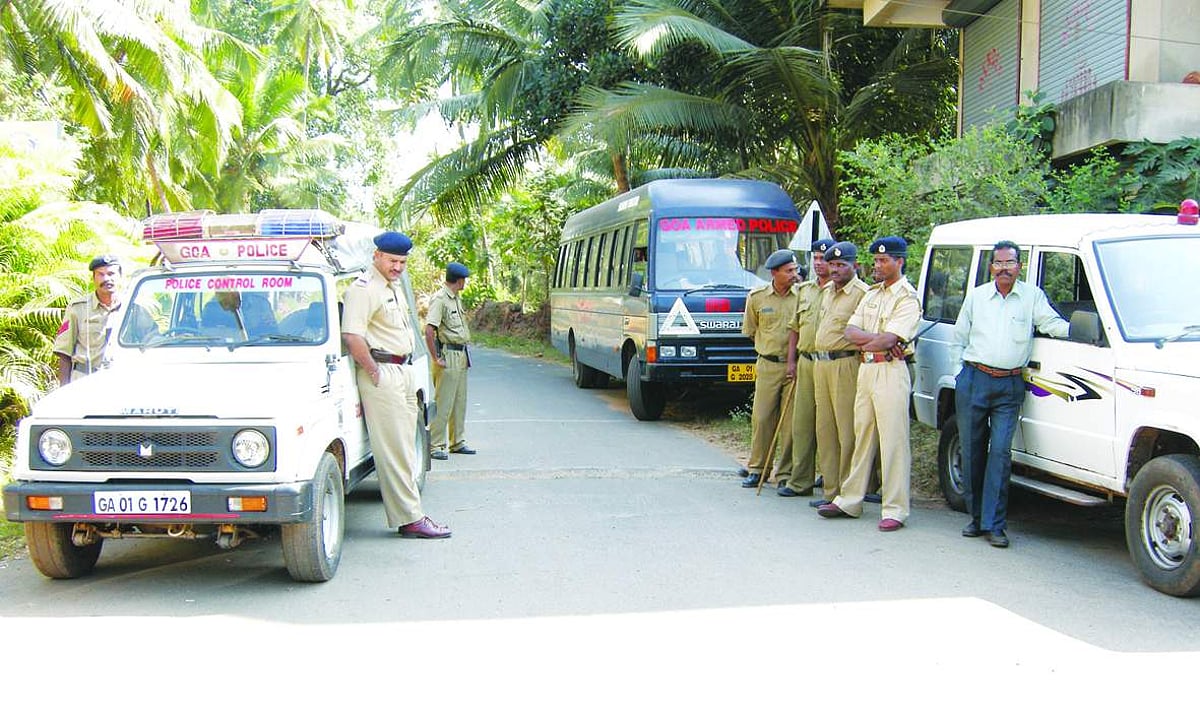 Policemen stand guard at the residence of Mickky Pacheco on friday.       Photo by vilino Fernandes
