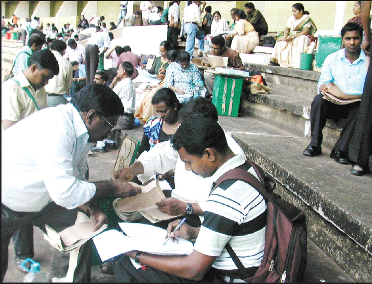 Poll officials sifting through election material at the Fatorda stadium on Saturday. Photo by Santosh Mirajkar