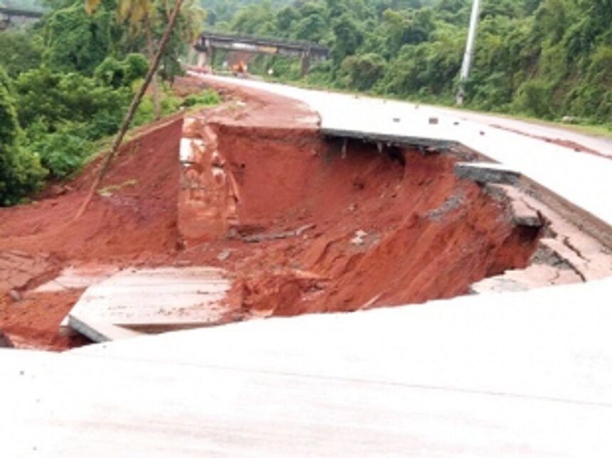 Portion of newly concretised highway,  retaining wall collapse at Pernem